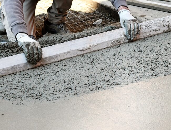 worker-flattening-concrete-floor